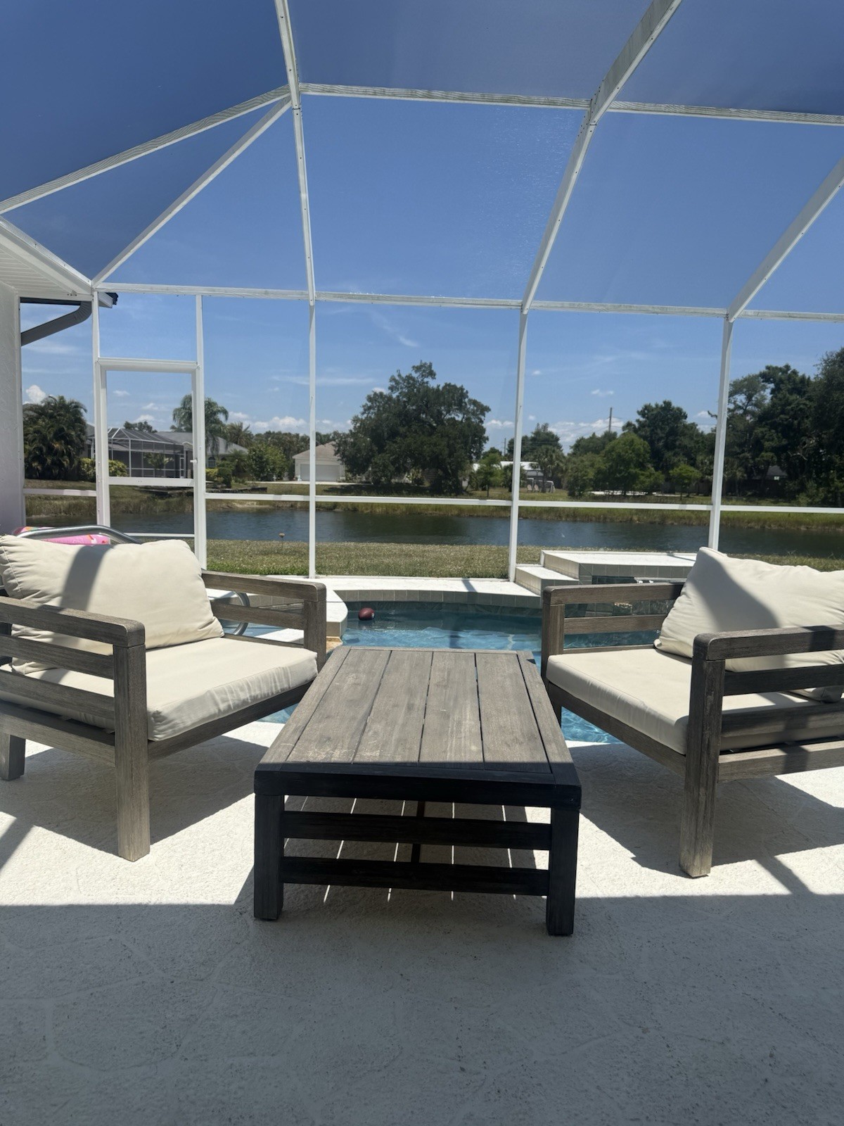 Modern Wood Lounge Set with Beige Cushions, Brown Chairs & Rectangular Table