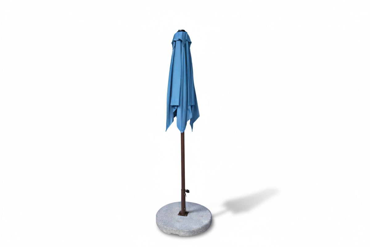 Blue patio umbrella on a stand with a white background