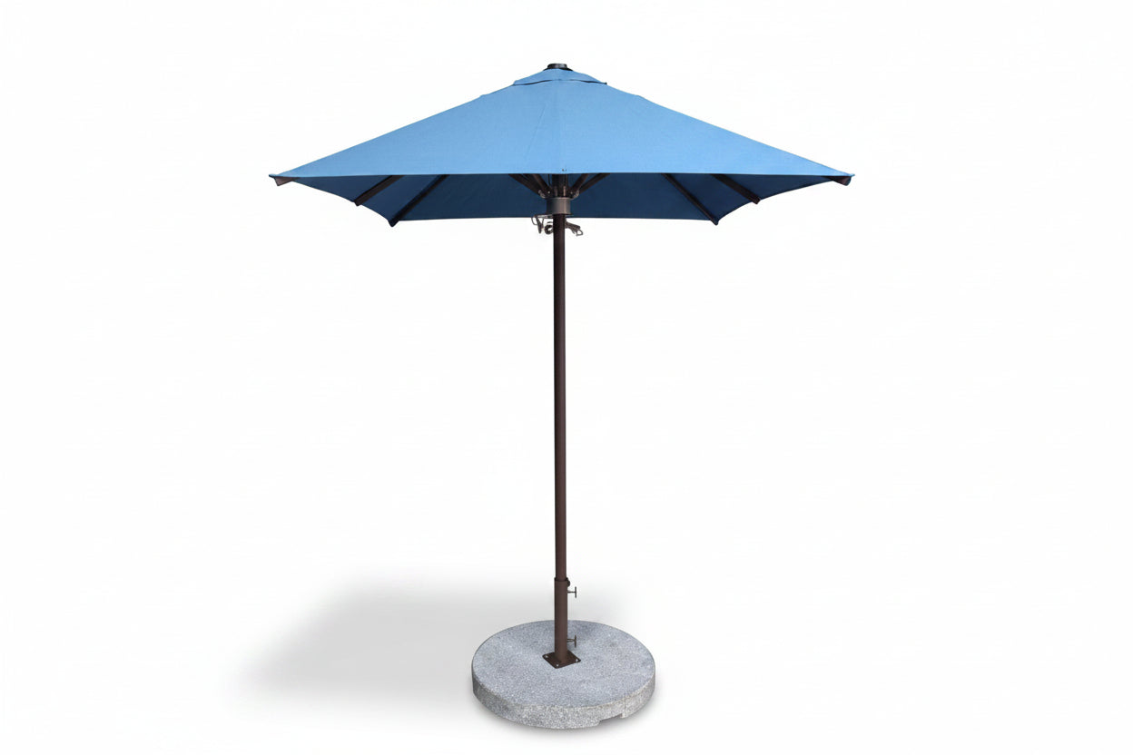 Blue patio umbrella with a stone base on a white background
